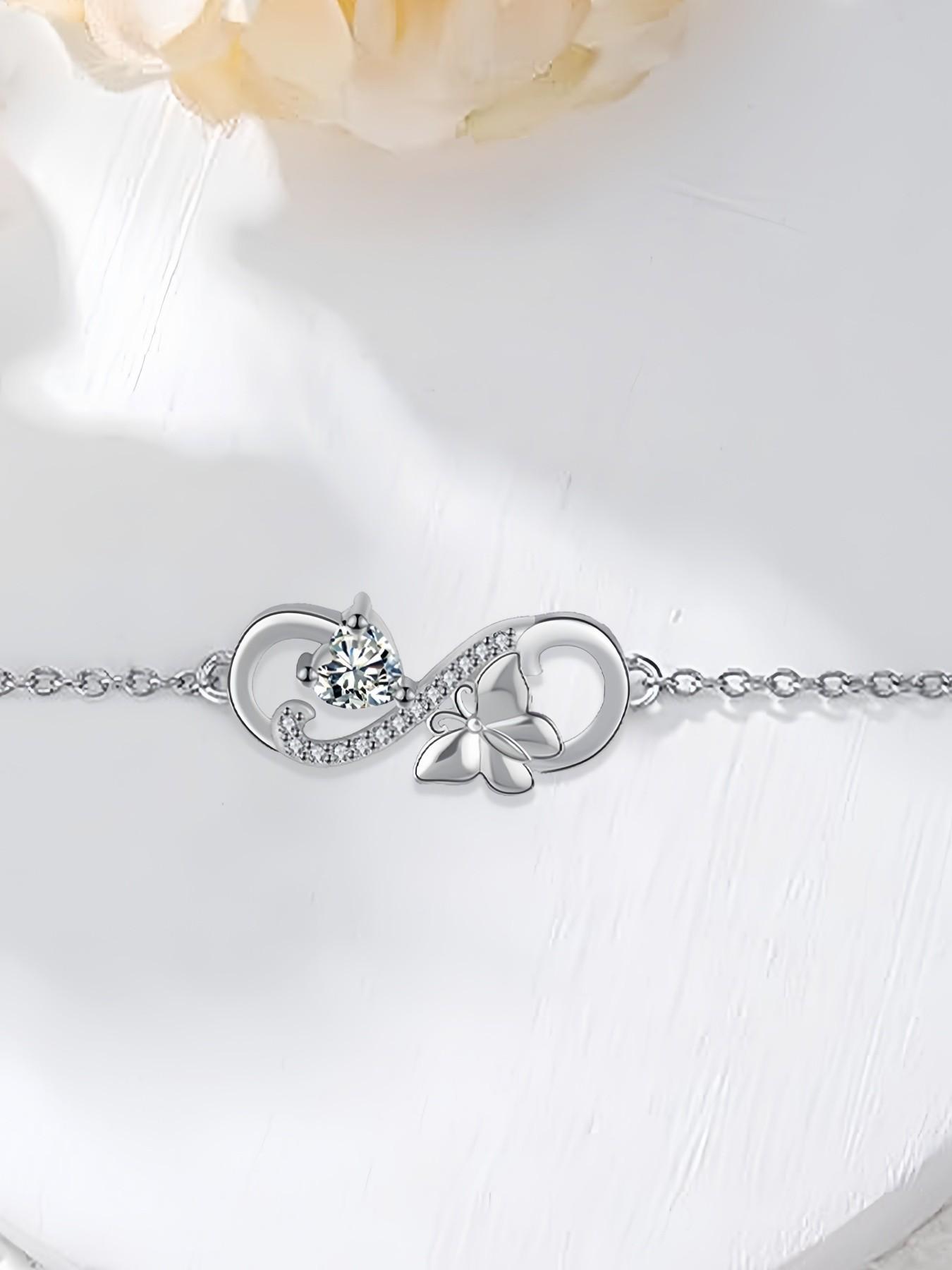Butterfly Infinity · Diamond Glow Adjustable infinity symbol butterfly gem bracelet, delicate and sparkling.Paired with a surprise double-door preserved rose jewelry gift box.Ideal gift for birthdays, Mother’s Day and Valentine’s Day.