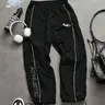【Black Friday】Men's Casual Sporty Long Pants, Loose Fit with Elastic Cuffs, Fashionable Print, Lightweight Fabric, Perfect for Daily Wear