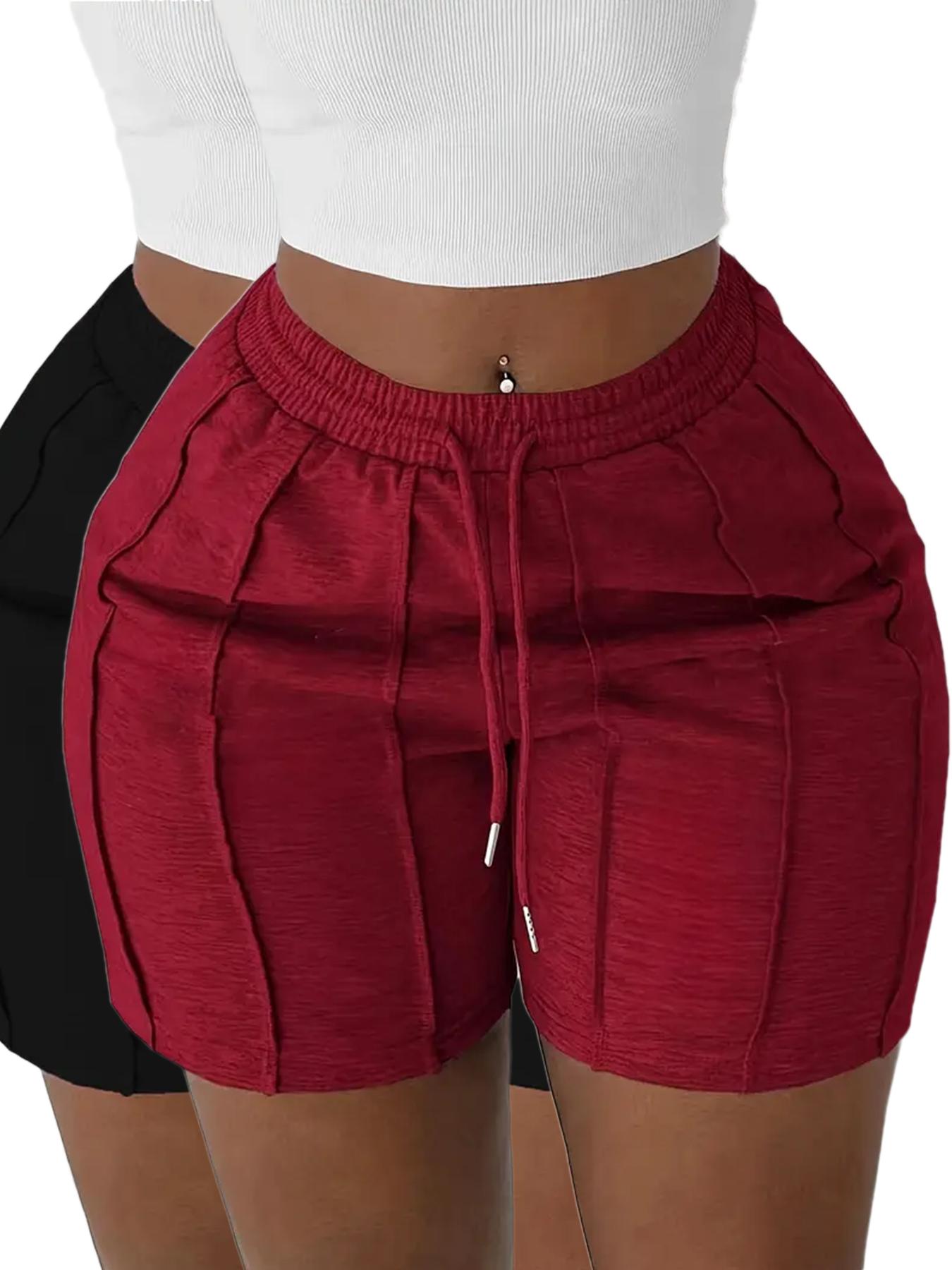 Pack of 2 solid-color drawstring athletic shorts with an elastic waistband and slanted pockets, casual style, suitable for spring, summer, and autumn.