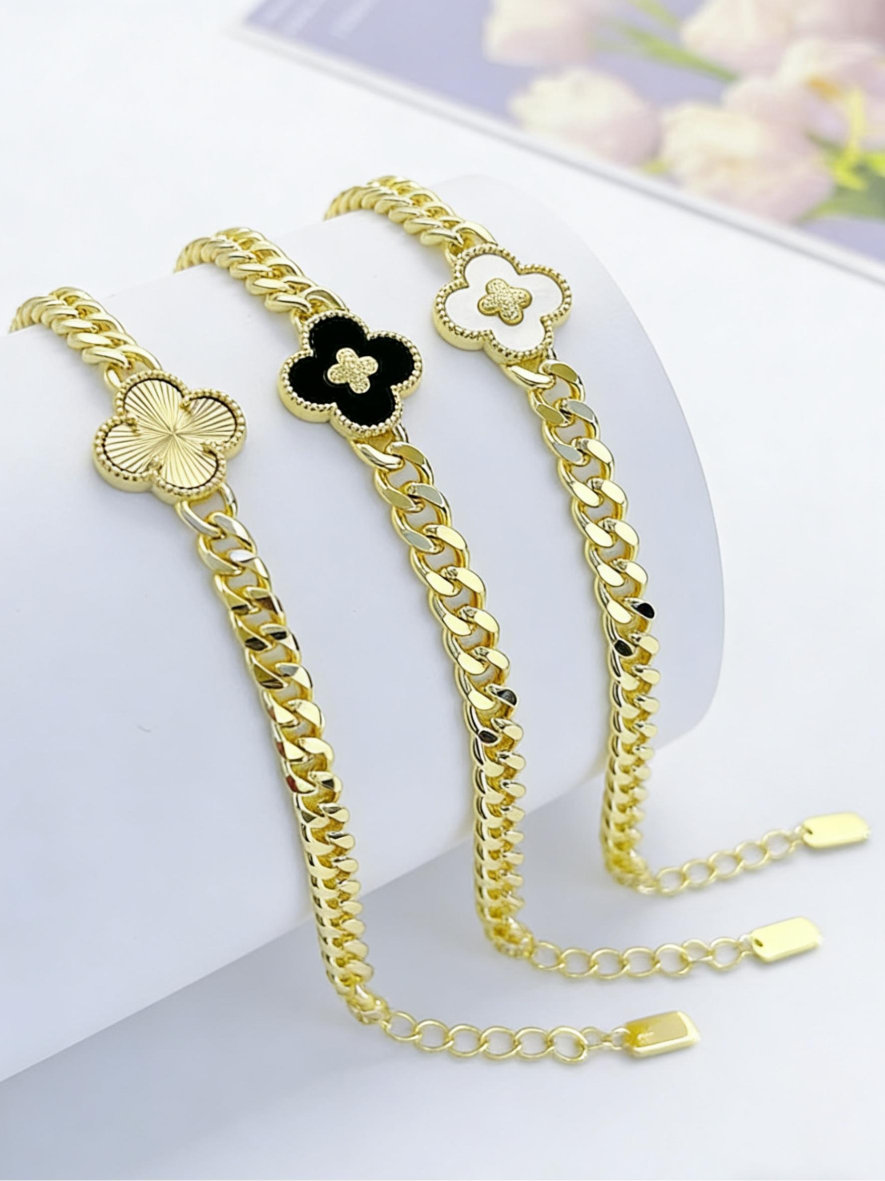 Women's shiny four-leaf clover floral shell 18K gold-plated jewelry bracelet, elegantly designed for daily wear.