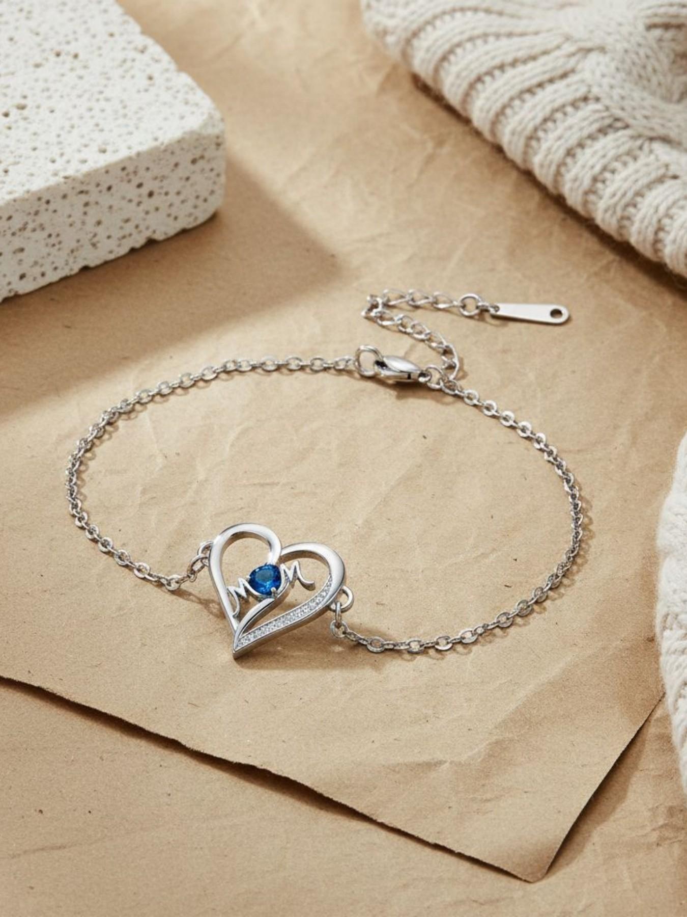 MOM Heartbeat · Blue Glow Simple luxury high-end heart-shaped MOM bracelet, elegant and warm.Paired with a surprise double-door preserved rose jewelry gift box.Ideal gift for birthdays, Mother’s Day and Valentine’s Day.