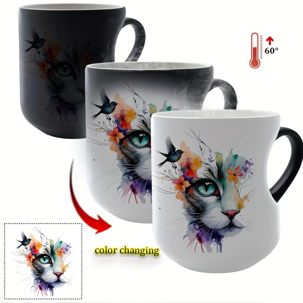 Playful Watercolor Cat Flower Decor: A vibrant artistic depiction set in a color-changing ceramic mug that changes color with temperature and features a heart-shaped handle. Perfect for coffee, this 11oz/330ml mug makes a wonderful Christmas gift