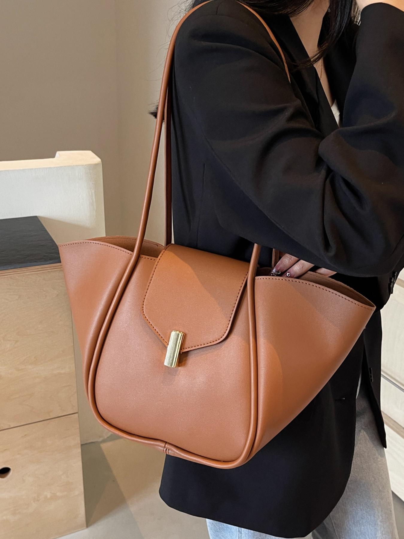 A niche and elegant shopping basket tote bag, a lock-button underarm bag, a simple solid color shoulder bag, a fashionable and textured shoulder commuter bag, a Casual Commuter Bag, suitable for daily matching, commuting and other scenarios