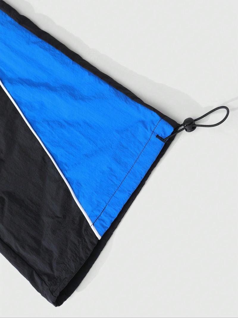 This men's two-piece Athletic Tracksuit Set includes a turtleneck jacket and sweatpants, featuring a striking blue and black color-block design with a unique sheen. Suitable for outdoor activities and casual wear, it also makes a great holiday gift.