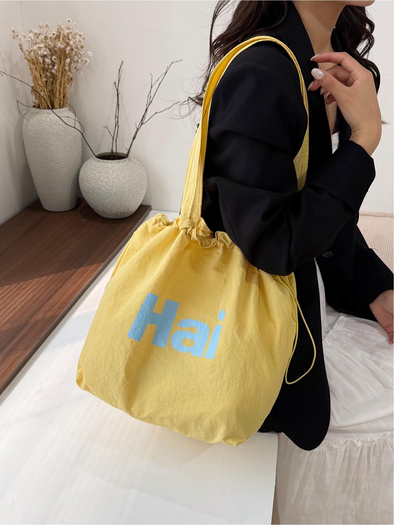 Large capacity drawstring tote bag with letters, simple casual shoulder bag, lightweight and comfortable, street style, work, shopping, underarm bag
