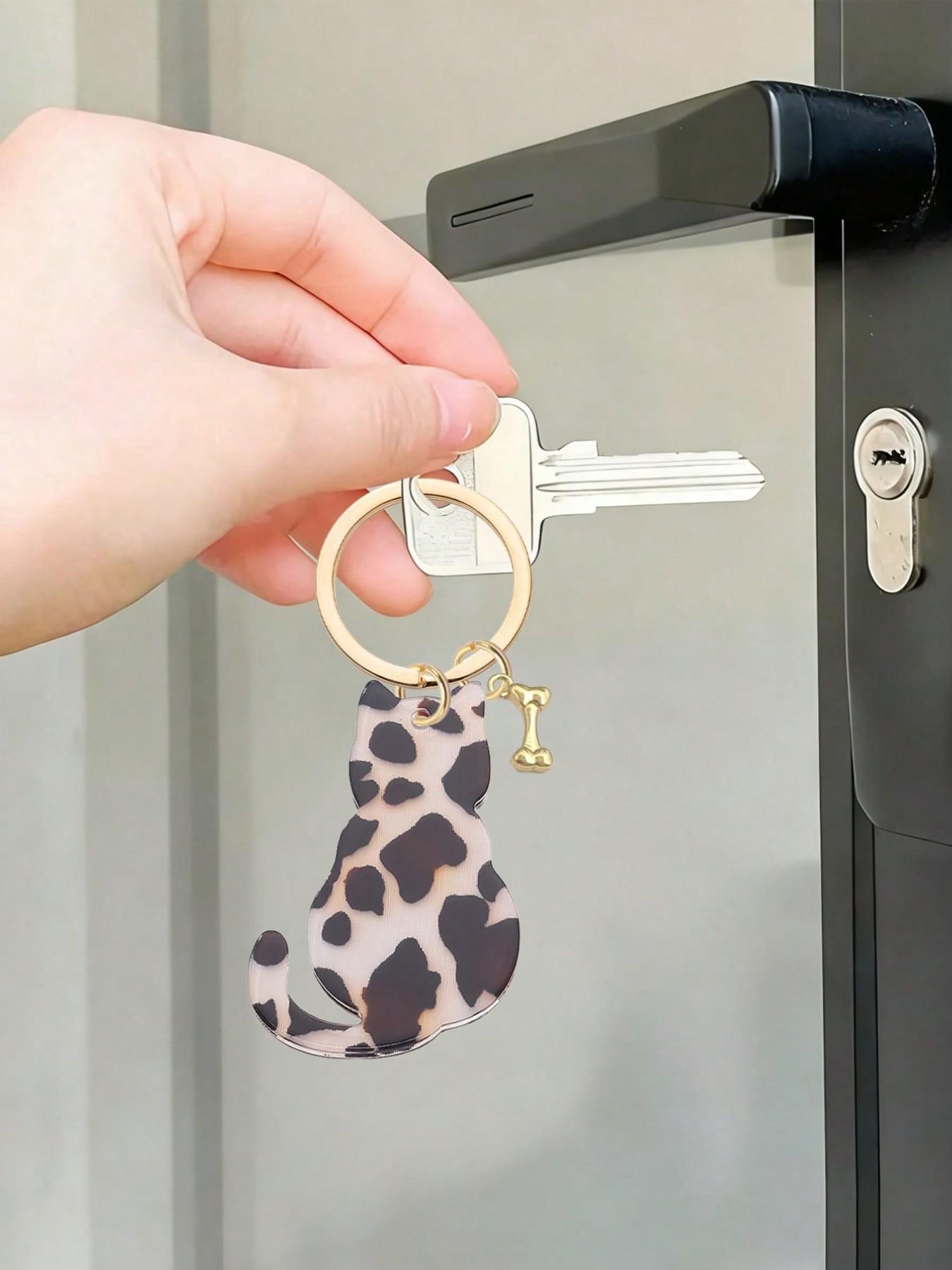 Double-sided acrylic leopard print cat and dog bone keychain, a fashionable, classic, and cool animal-themed bag accessory and DIY jewelry component. Can be attached to backpacks, handbags, car keys, house keys, and phone accessories. Versatile Attachment