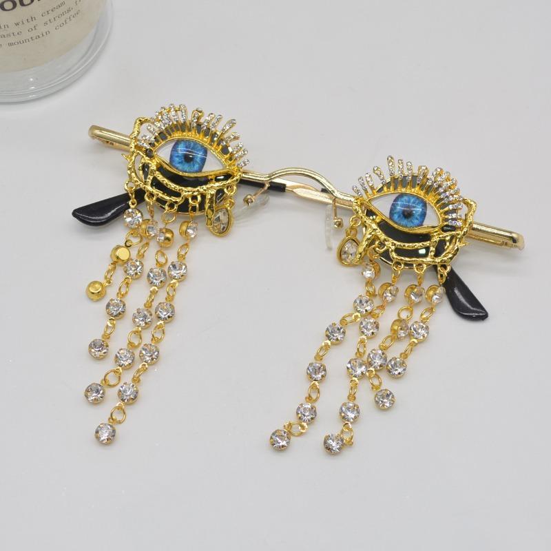 Golden tassels on Halloween witch sunglasses