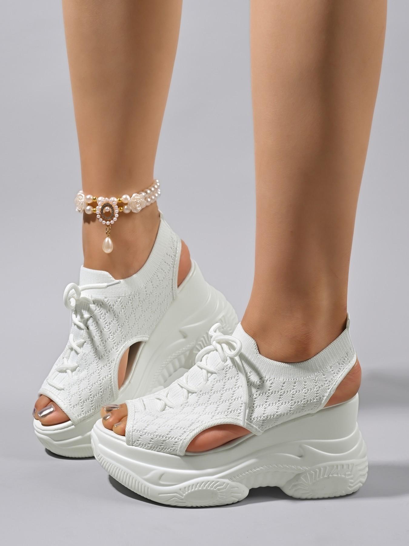 The new women's wedge heel sandals for the summer of 2026, with thick soles and high heels, are fashionable and stylish with a sponge sole. The fusion of fashion and comfort makes you the focus of summer. Fashionable Heeled Sandals