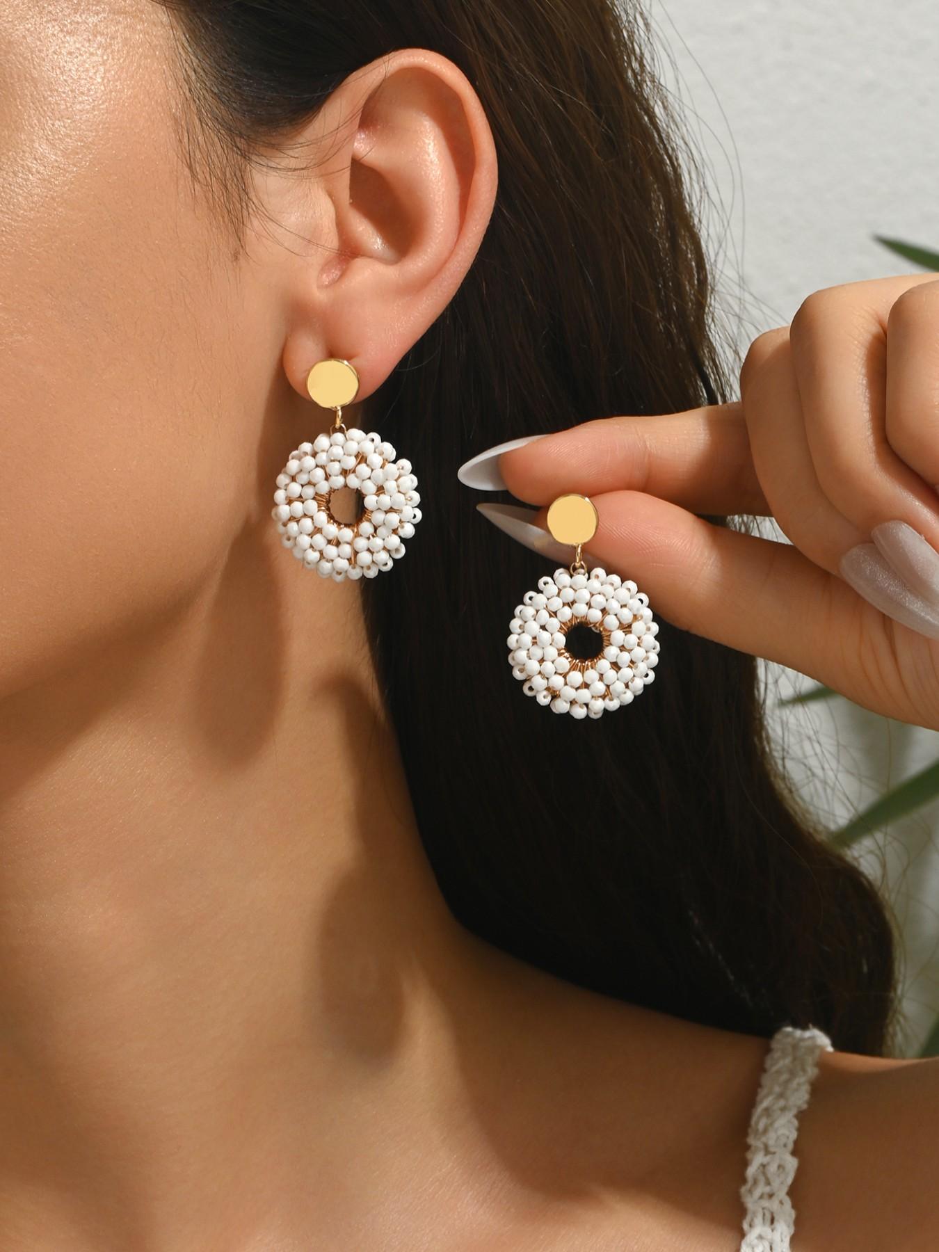 A pair of pure handmade, beaded circular dangle earrings featuring a dazzling "Bling-Bling" effect and a chic Bohemian resort style. These vintage-inspired, ethnic-style earrings offer a unique, versatile, and minimalist aesthetic—exuding elegance