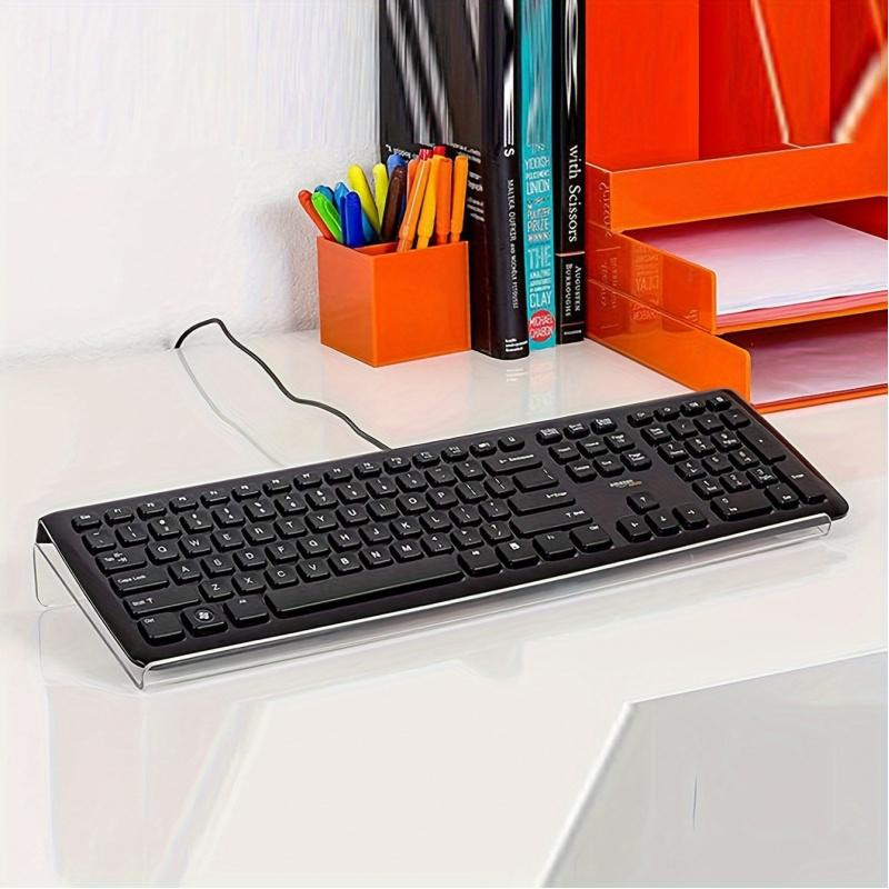 1-piece inclined PC keyboard stand made of high-toughness organic material, shatterproof and durable. The ergonomic tilted design ensures comfortable use, suitable for offices, homes and schools for easy height adjustment and storage.
