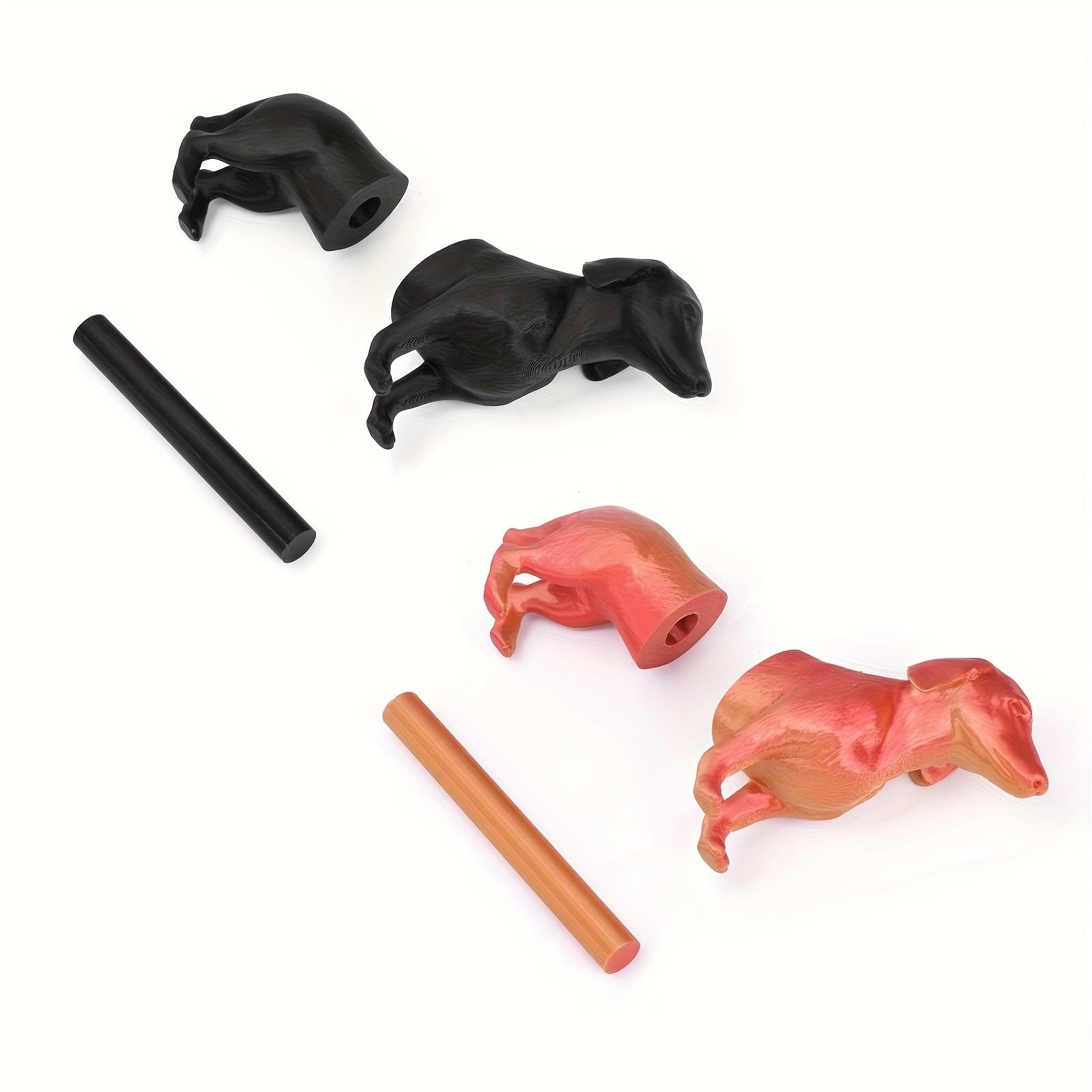 A humorous sausage dog-themed toilet paper holder - an independent black roll holder featuring a cute dog design, made of sturdy plastic and also suitable for kitchen paper towels