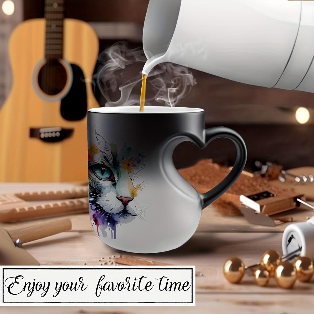 Playful Watercolor Cat Flower Decor: A vibrant artistic depiction set in a color-changing ceramic mug that changes color with temperature and features a heart-shaped handle. Perfect for coffee, this 11oz/330ml mug makes a wonderful Christmas gift