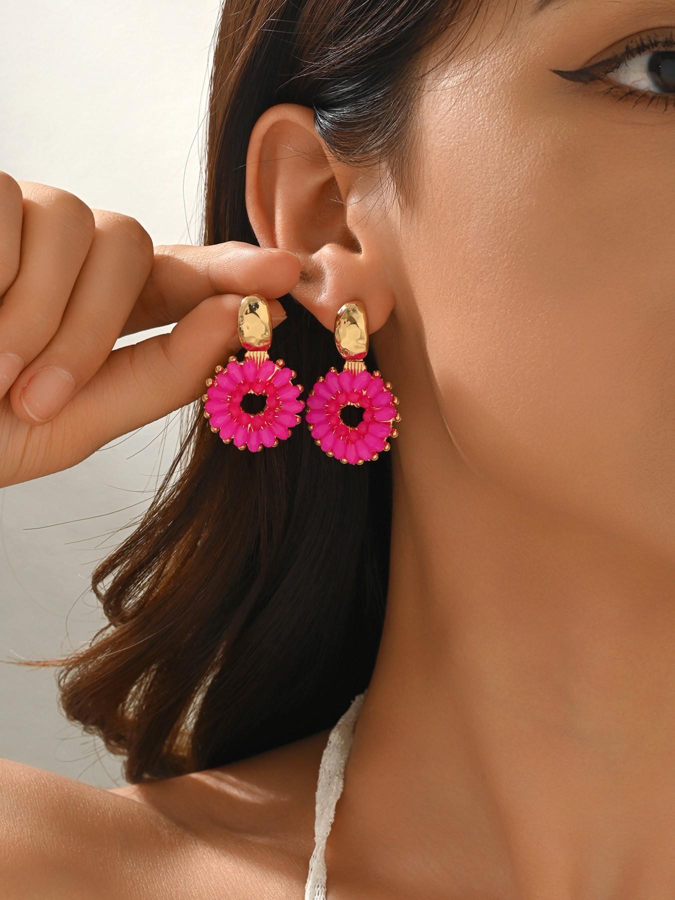 A pair of handcrafted, beaded dangle earrings featuring a chic Bohemian resort style. These round earrings exude an elegant, refined, and understated aesthetic with a premium feel, available in a variety of colors. for women to wear on any occasio