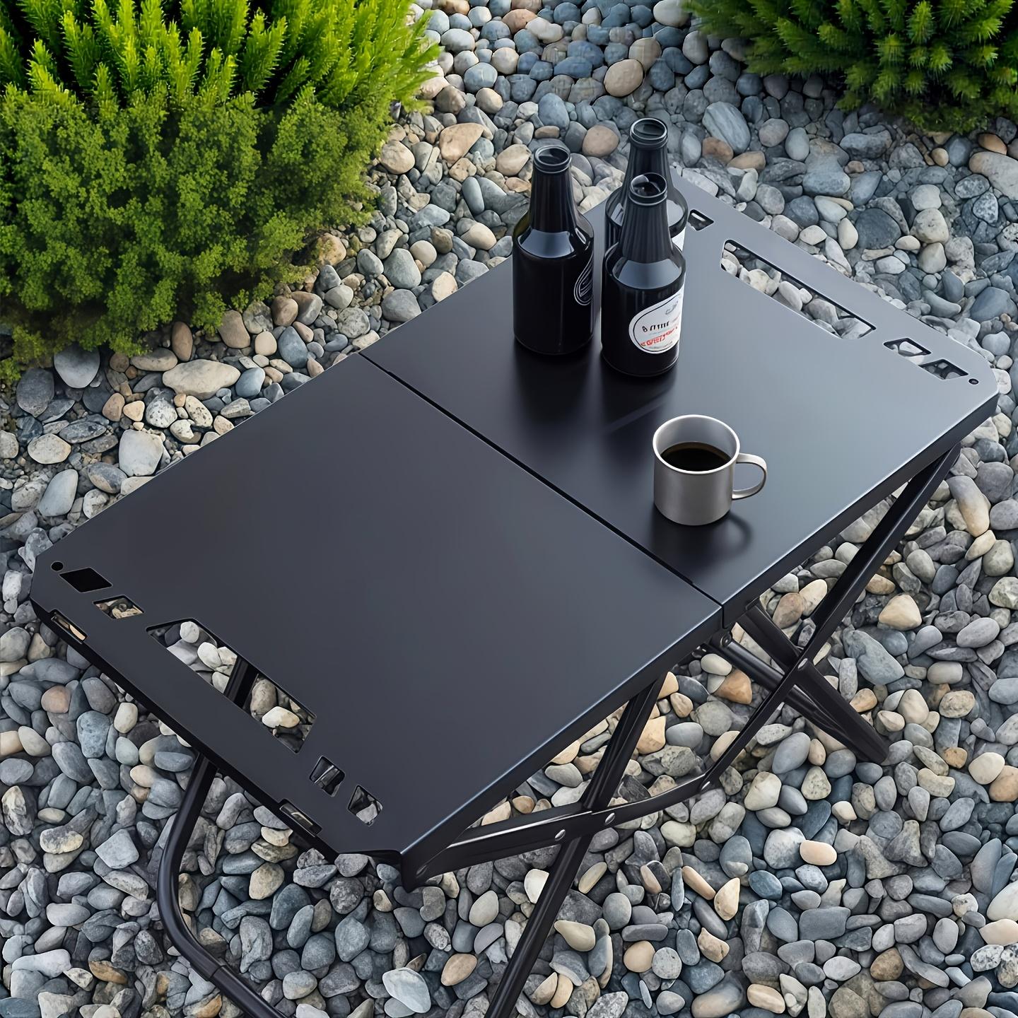 Portable foldable camping table, lightweight and easy to set up for outdoor use. It features a stable three-legged design, suitable for courtyards, picnics, barbecues and outdoor adventures.