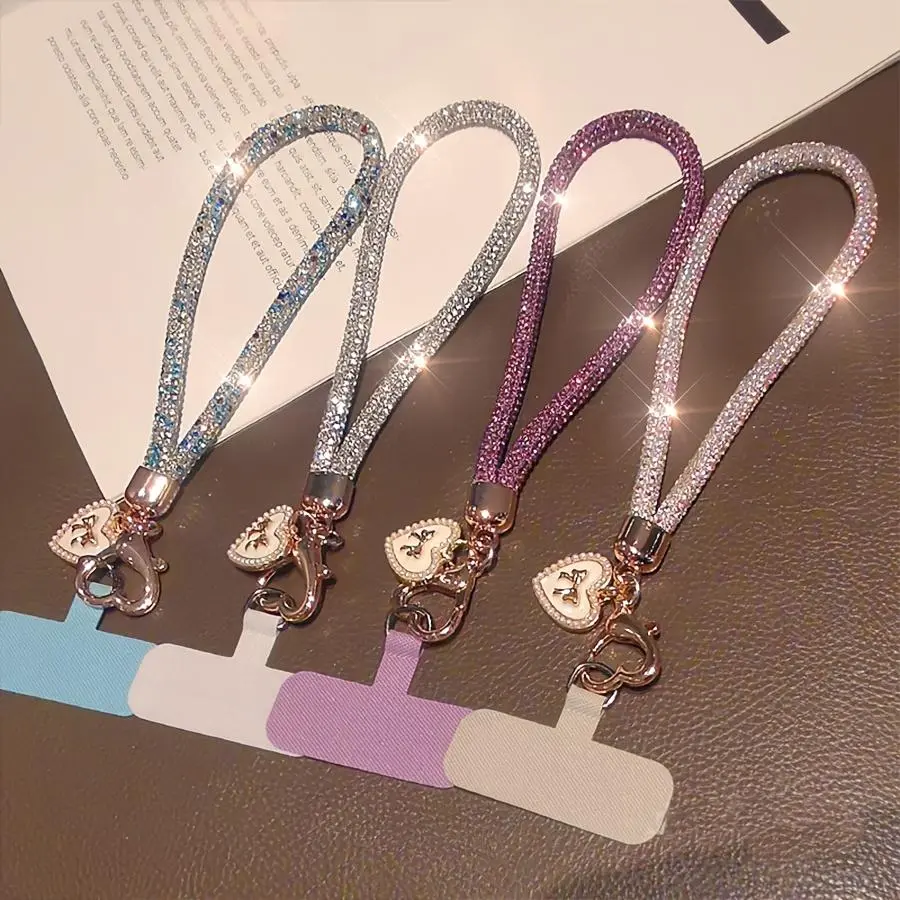 Women's Diamond-Adorned Luxury Mobile Phone Lanyard with Short Bowknot, Heart Tag Pendant, and Stylish Anti-Loss Design