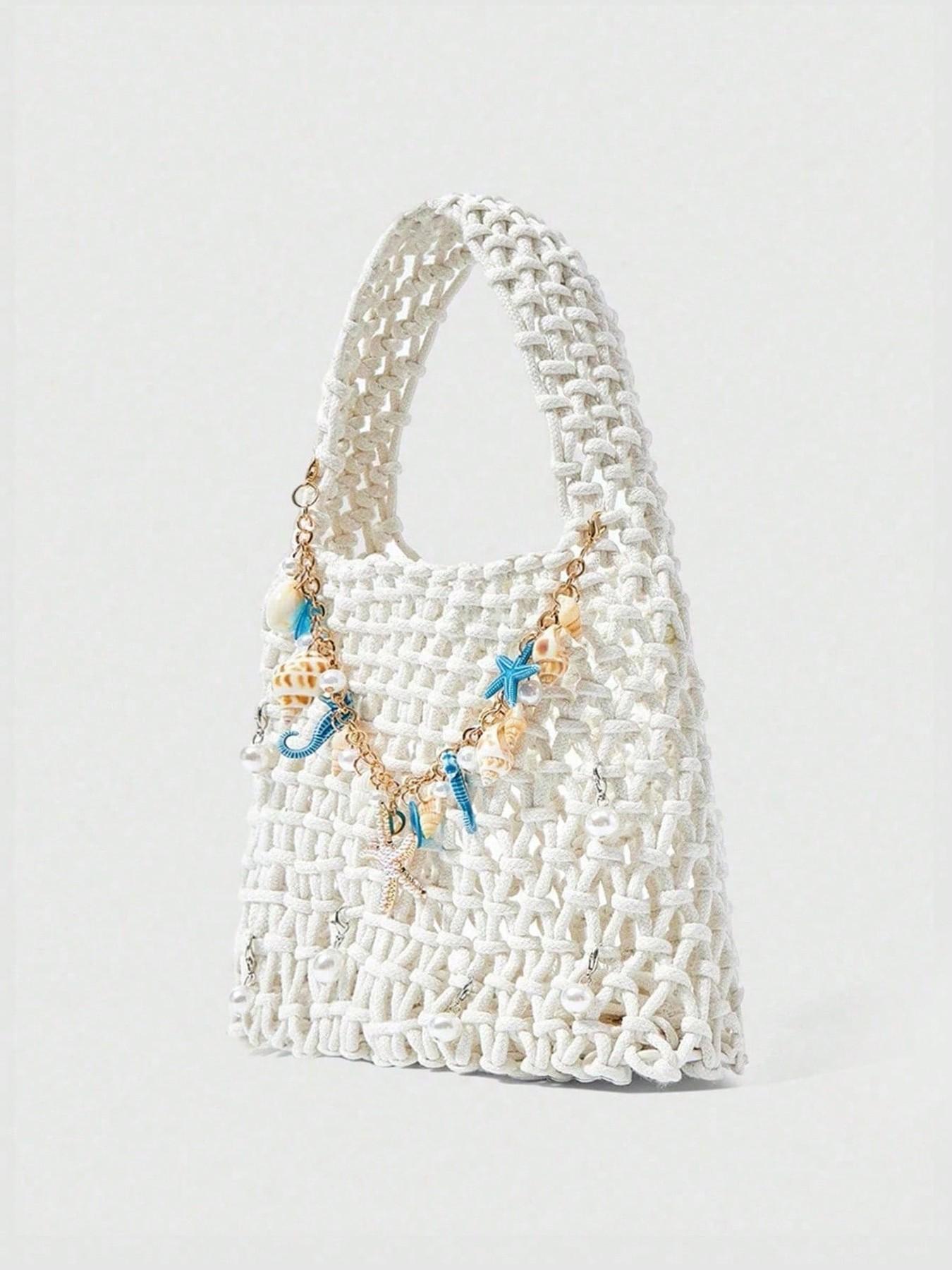 Fresh and artistic style practical texture woven handbag, embellished with starfish, seahorse, shell, pearl, chain, woven long shoulder strap, beige background, suitable for date/vacation dressing scenes
