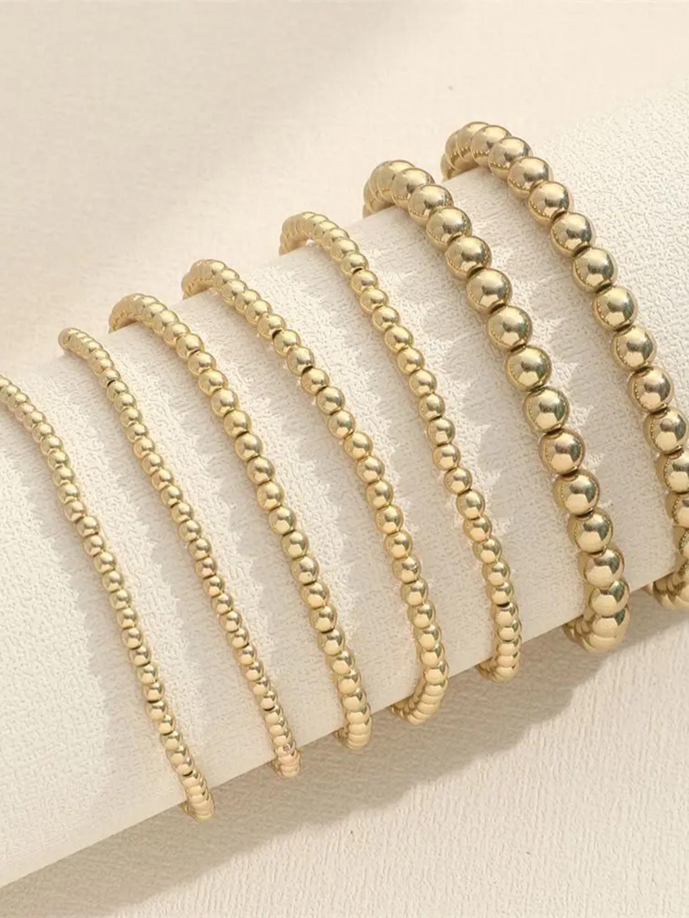 A 7-piece set of gold elastic Stackable Bracelets, with a retro style suitable for daily wear, vacation dates, and other occasions. It is also a surprising and exquisite small gift