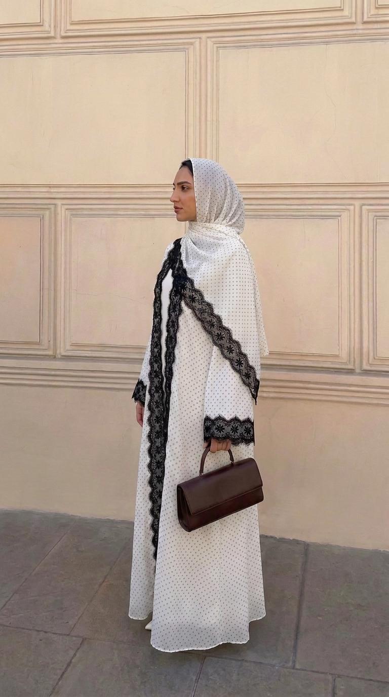 CL84 Elegant polka‑dot open abaya with matching hijab, delicate floral lace trim, soft premium‑quality fabric. White‑black and black‑white lace versions. Great for daily and formal occasions, ideal modest wear for hijabi women.