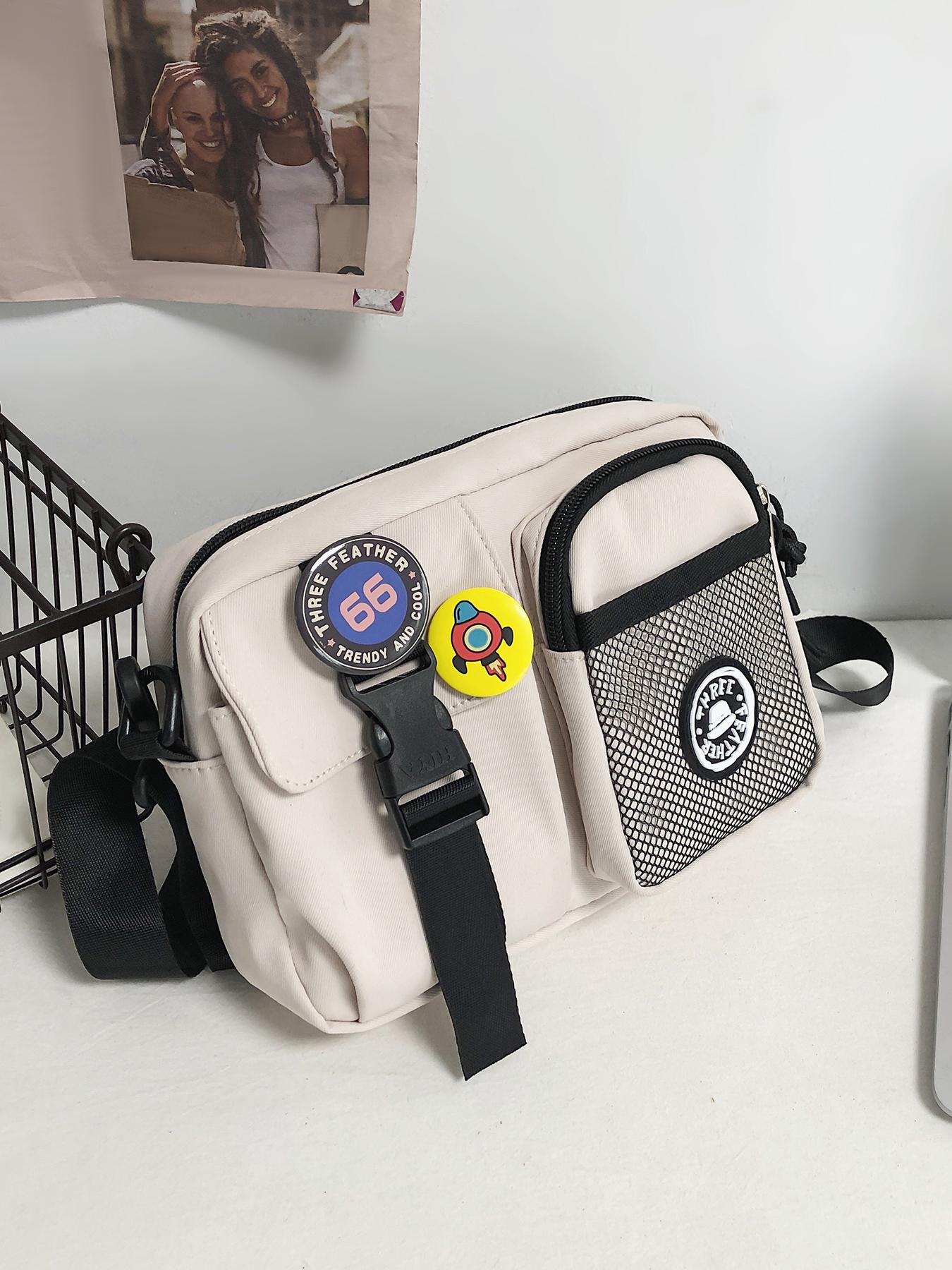 Black fashionable casual simple shoulder bag, practical and atmospheric texture crossbody bag, with badge and alien pendant pendant design, can accommodate mobile phones and keys, suitable for walking and shopping