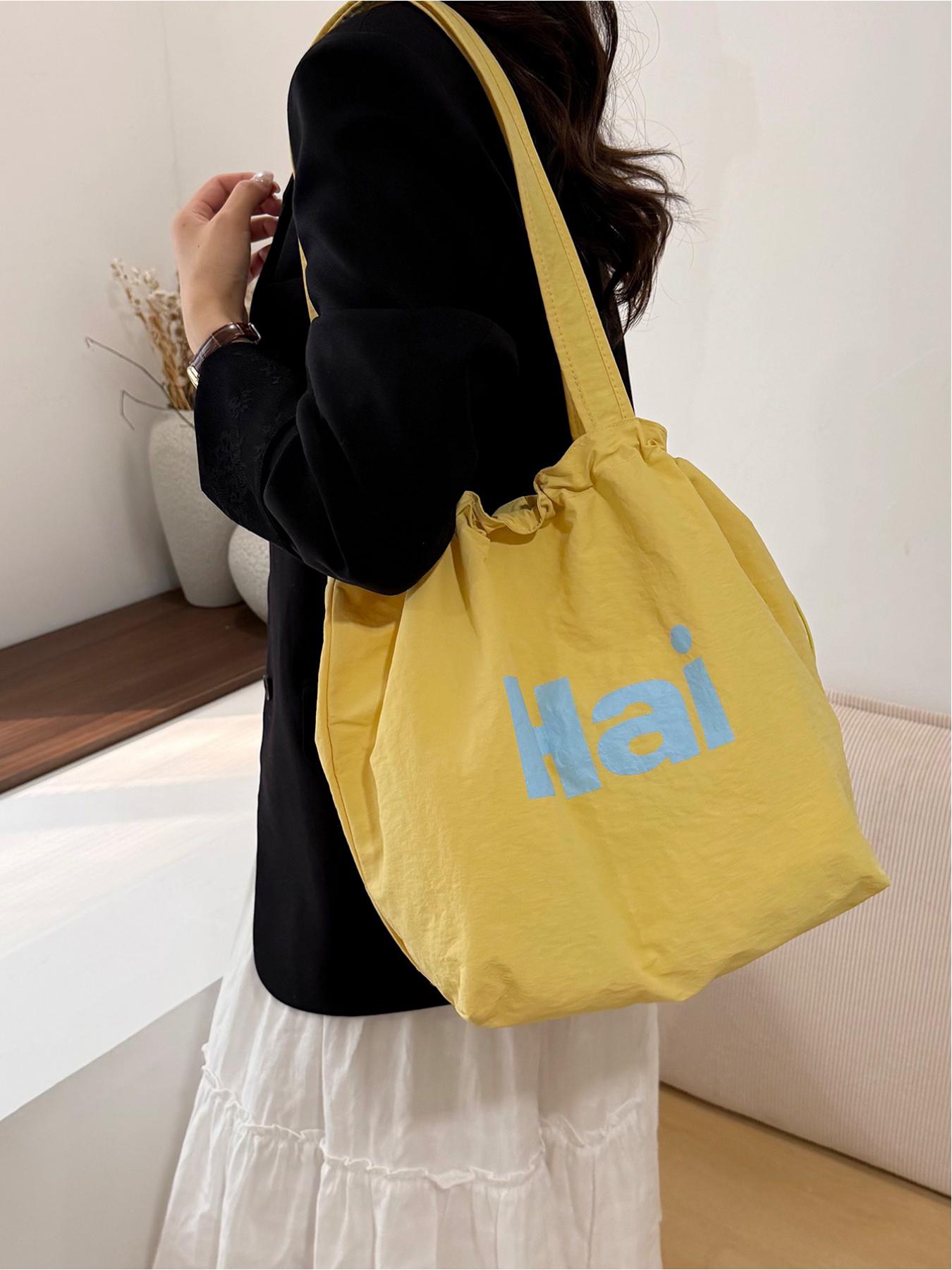 Large capacity drawstring tote bag with letters, simple casual shoulder bag, lightweight and comfortable, street style, work, shopping, underarm bag