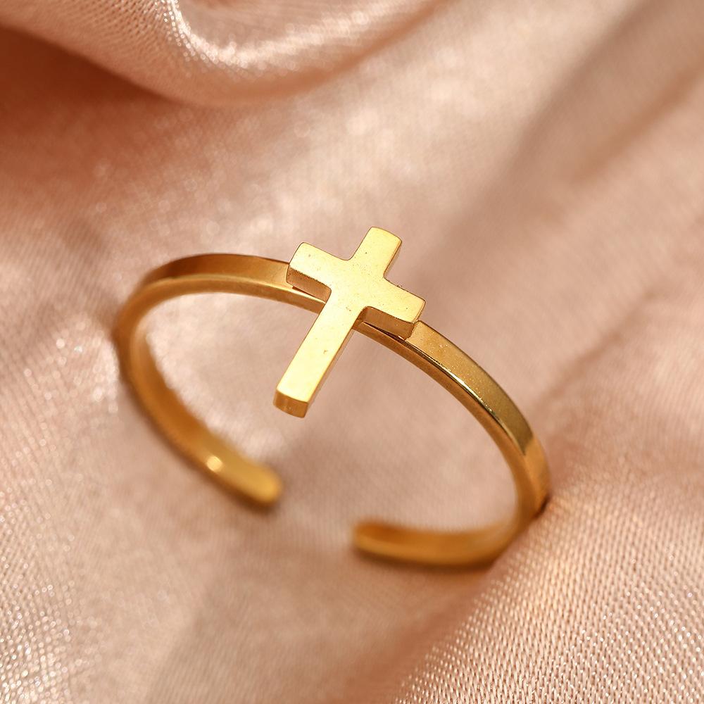 Exclusive and moderately luxurious cross-shaped open ring for couples. A pair of stainless steel jewelry for hands.