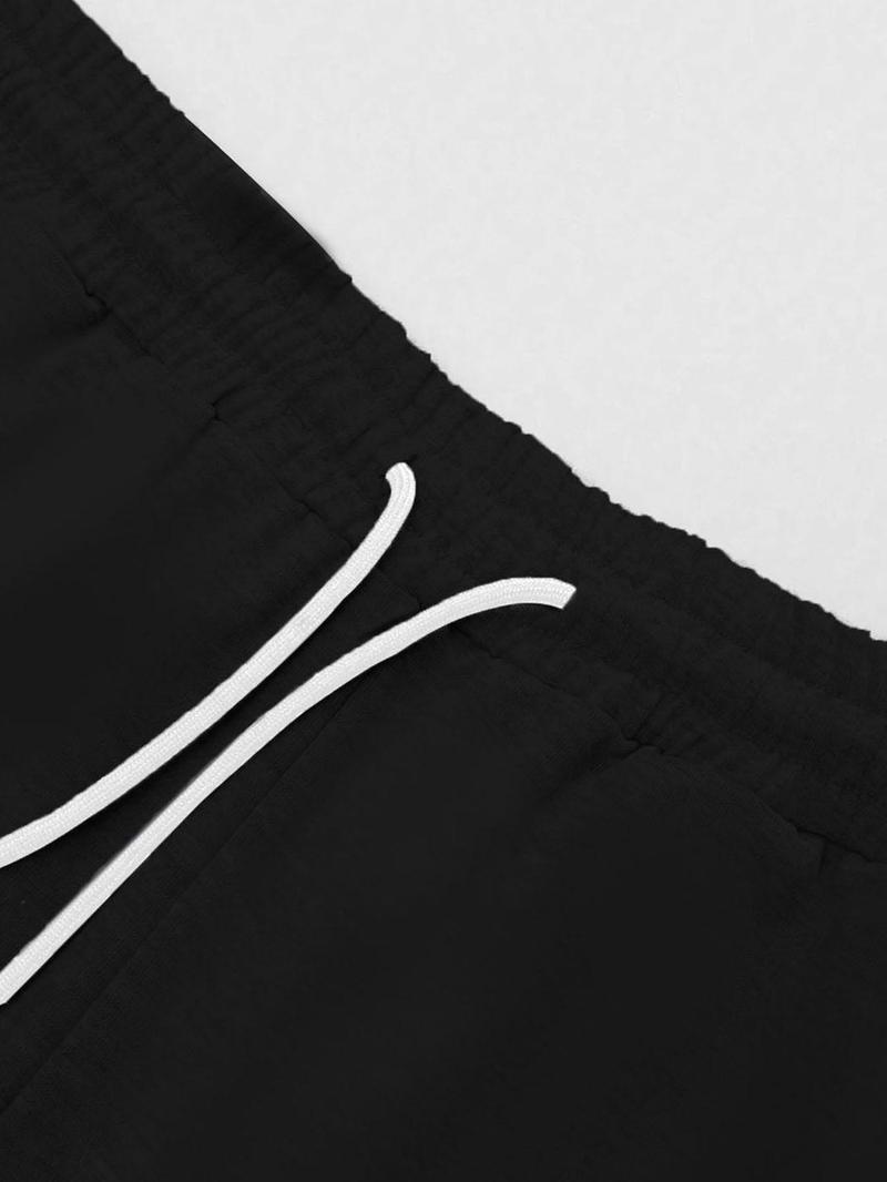 A teenage girl's off-shoulder top and wide-leg casual trousers; a loose-fitting, oversized casual long-sleeved top with a letter print paired with loose-fitting drawstring trousers; soft, suitable for women, and versatile.