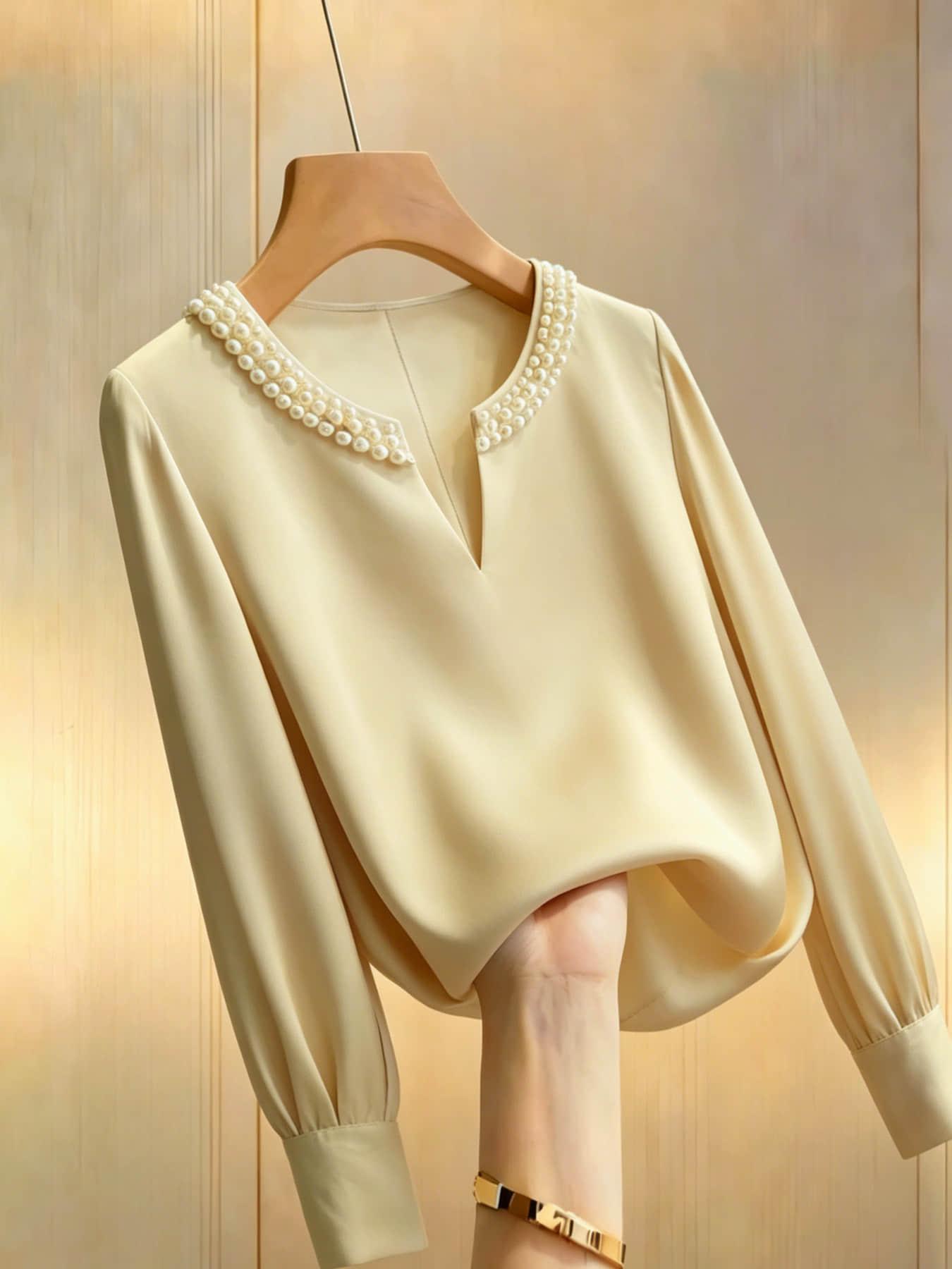 A women's pearl collar top, Blouse, with a V-neck small open neck, loose and versatile, showing off a slimming temperament. It is suitable for summer, business negotiations, customer meetings, commuting