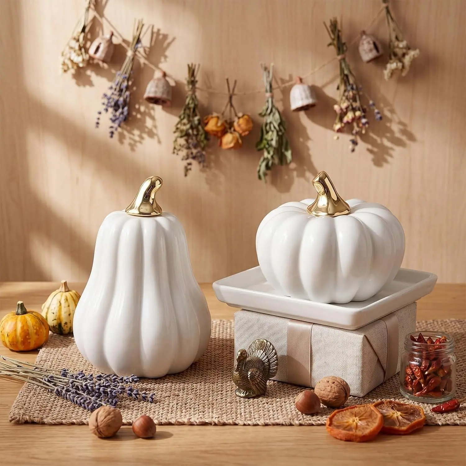 Small ceramic pumpkin decoration set for Halloween, with golden stem design and in orange and white colors. A great item for creating an autumn harvest atmosphere. Ideal for Halloween and Christmas-themed table decorations.
