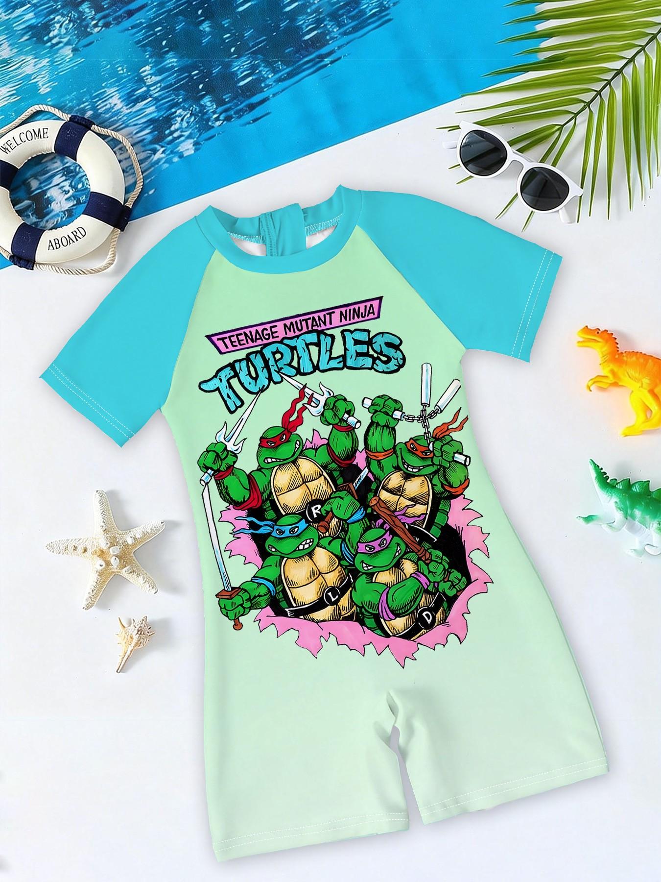 Boys' one-piece swimsuit "Ninja Turtles Breakthrough Screen Edition" features full vintage Ninja Turtles breakthrough screen print and raglan lake-blue sleeves. It is trendy, cool and sun-protective, eye-catching for summer water play and beach vacations.