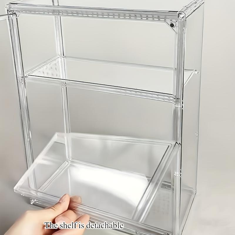 Multi-layer shelf transparent display cabinet provides ideal protection for collectibles and valuables in modern homes. It does not require electricity or batteries.