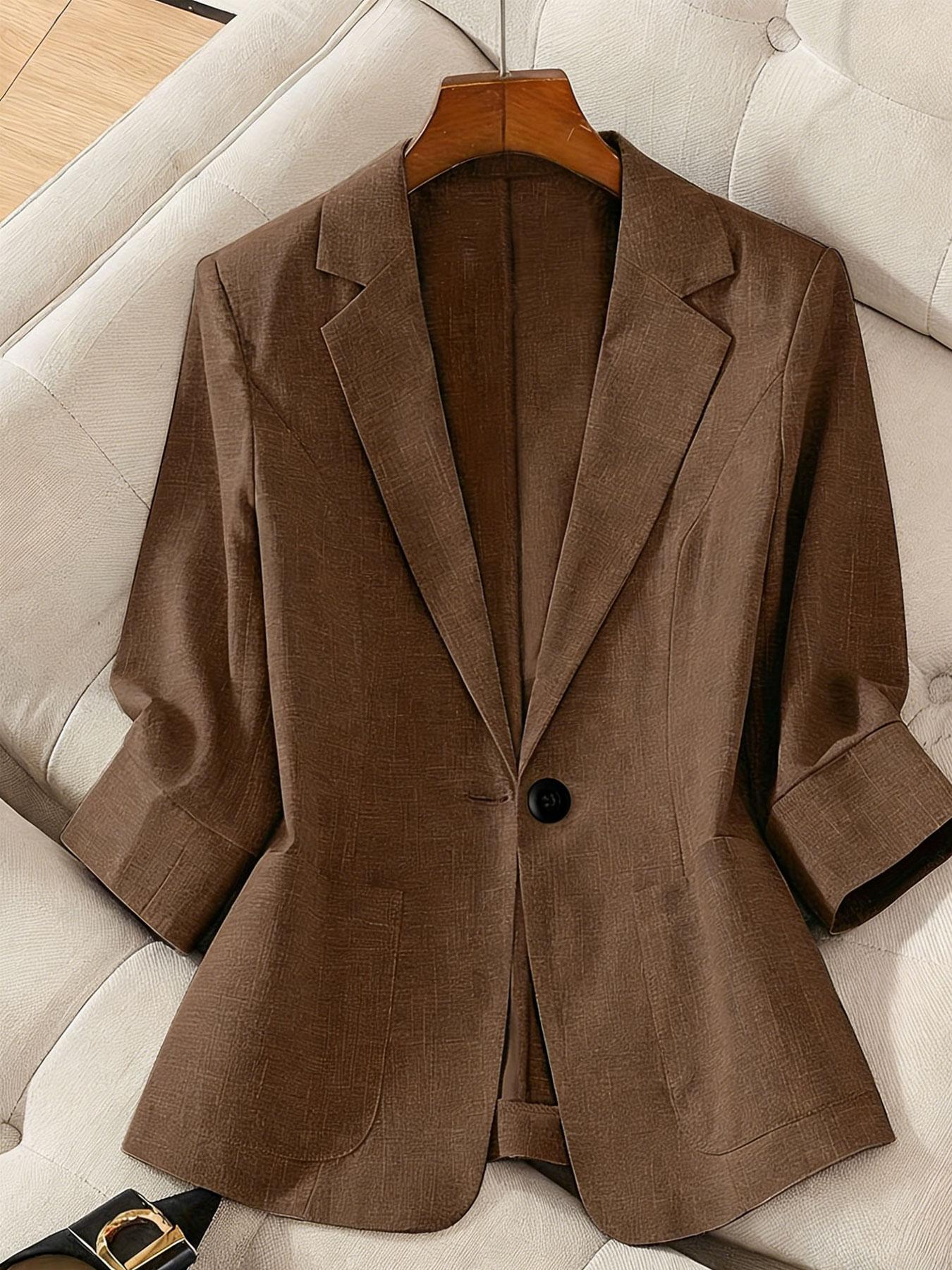 A women's solid color lapel single-breasted single-button mid-length sleeve double-pocket stylish blazer, suitable for spring and summer, appropriate for the workplace and daily wear.