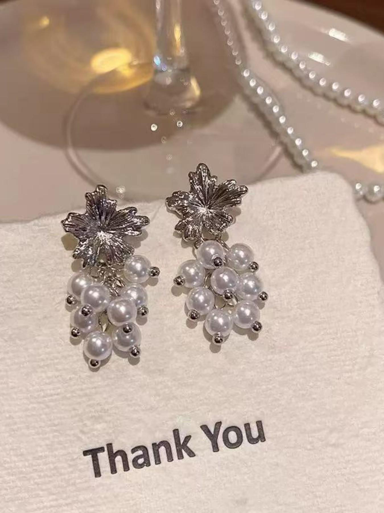 Exquisite metallic maple leaf shape with layered pearl tassels, creating a gentle and romantic vibe. The dangle design sways elegantly, adding a touch of sophistication to your daily look.