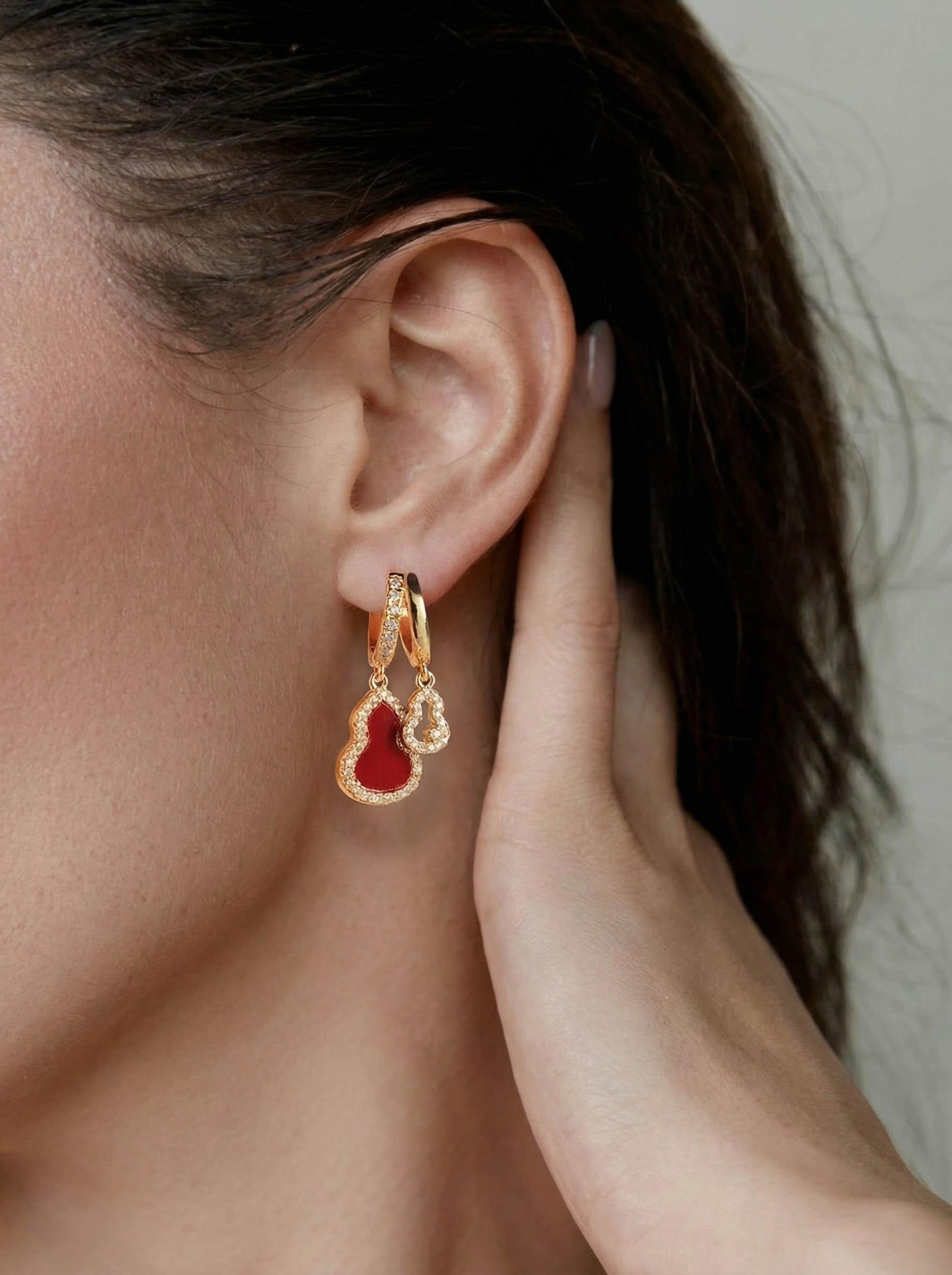 A pair of zirconia drop earrings featuring openwork ear hooks with real gold plating in an elegant, light-luxury Oriental style exquisite, versatile New Chinese-style earrings