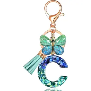 JINGUAZI Initial letter Keychains for Women Tassel Butterfly Pink Purple Cute Car Keychain for Wallet Backpack bag charm