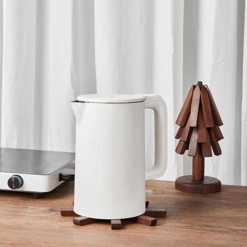 2026 Natural Tree Trivet Set - Christmas Tree Design! This heat - resistant set includes 4 walnut - wood trivets and 1 stand, stored like a Christmas tree. A foldable kitchen decor art, perfect for pots, bowls, coffee mugs, teapots and hot pots.