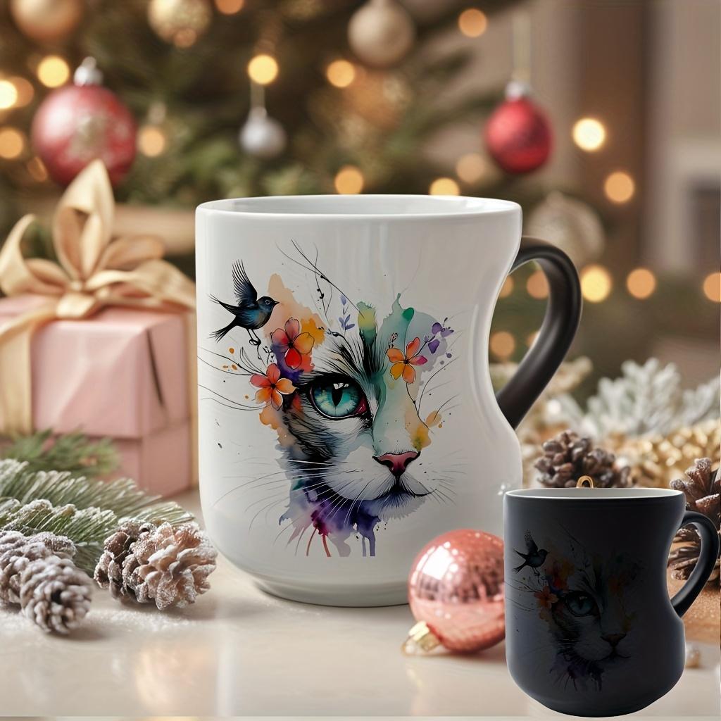 Playful Watercolor Cat Flower Decor: A vibrant artistic depiction set in a color-changing ceramic mug that changes color with temperature and features a heart-shaped handle. Perfect for coffee, this 11oz/330ml mug makes a wonderful Christmas gift