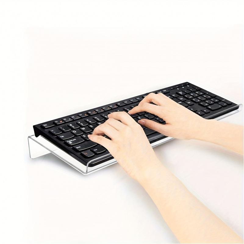 1-piece inclined PC keyboard stand made of high-toughness organic material, shatterproof and durable. The ergonomic tilted design ensures comfortable use, suitable for offices, homes and schools for easy height adjustment and storage.