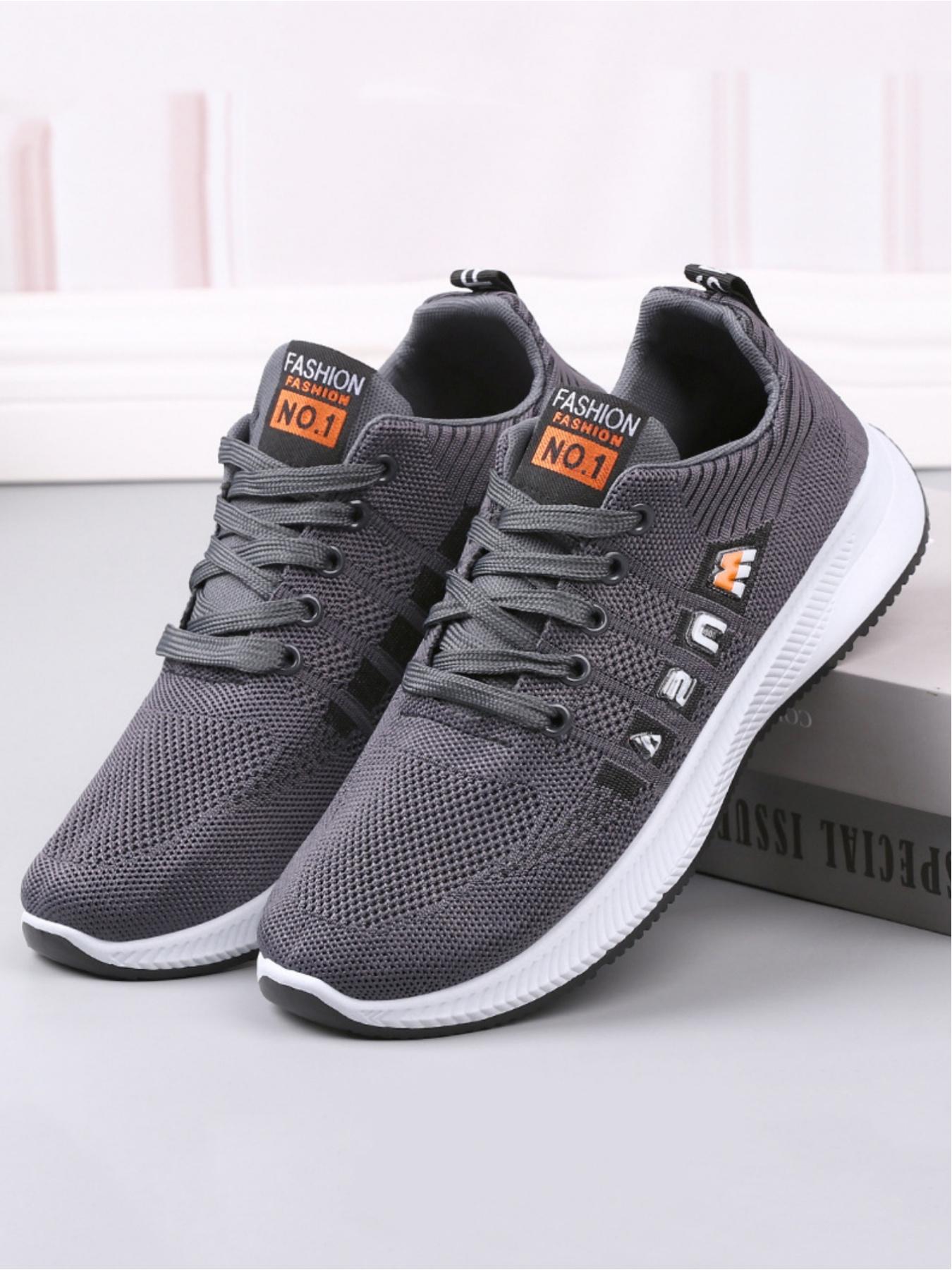 Men's casual sports shoes, made of breathable and comfortable mesh material, with stylish and eye-catching labels, personalized letter decoration design, simple and contrasting red border lines, suitable for daily wear and easy travel