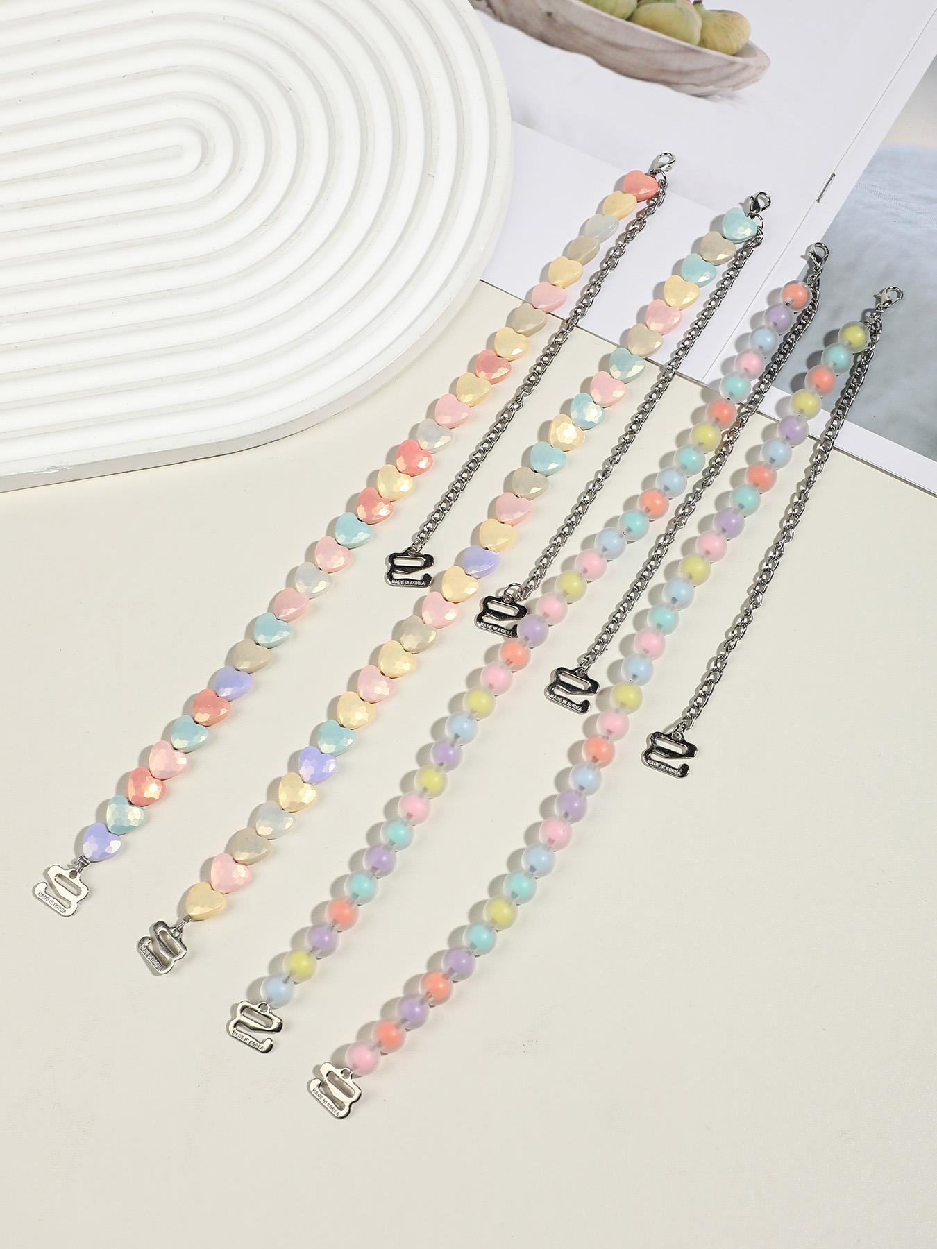 Macaron-colored heart-shaped round bead bra straps, candy-hued resin-beaded invisible lingerie straps, non-slip and wearable as an exposed accessory—perfect for everyday outfits and summer styling.