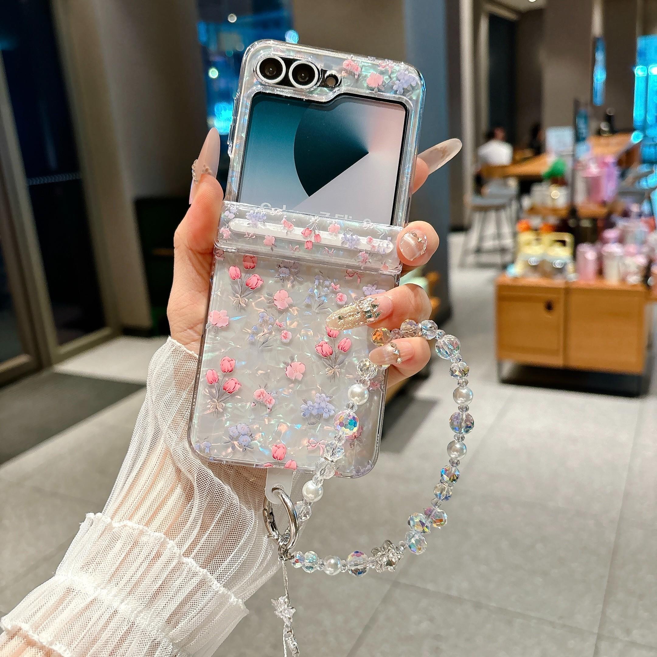 Fresh Floral & Magnetic Snap Shell Pattern Phone Case with optional wrist strap for easy carrying. for Samsung Galaxy Z Flip 5/6/7FE/7. Features a refreshing style, fashionable protection, and unique design perfect for daily use. Protective outer shell.