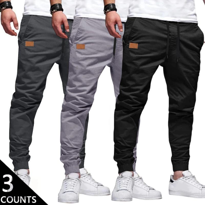Men's 3-Pack Casual Jogger Pants - Khaki, Grey & Black Colors - Elastic Waist with Drawstring, Ribbed Cuffs, PU Patch Detail - Lightweight 100% Polyester Fabric - Perfect for Streetwear, Travel, Daily Wear - S-3XL Sizes We recommend buying one size up.