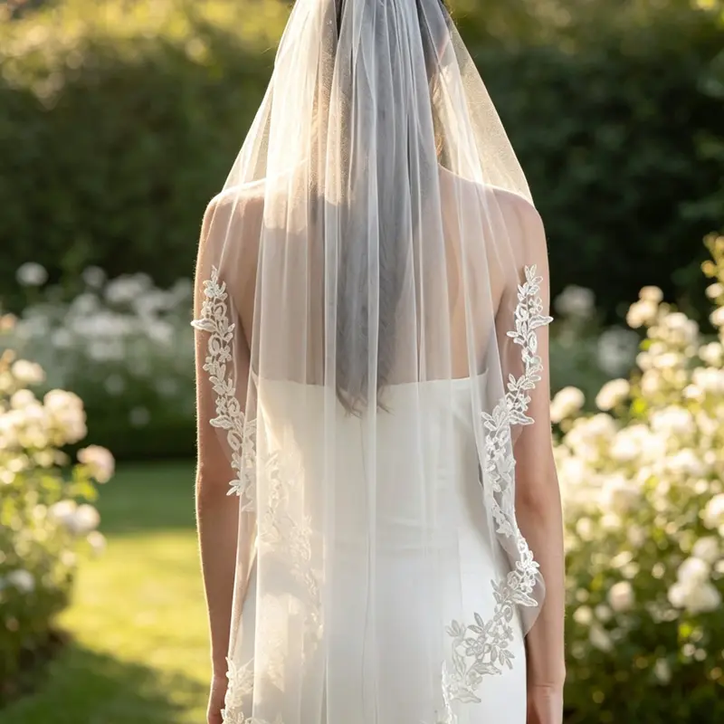 Elegant mid-length bridal veil featuring soft tulle and delicate floral lace trim—a French-inspired, affordable luxury accessory perfect for weddings and bridal photography. Wedding veils for brides The wedding veil
