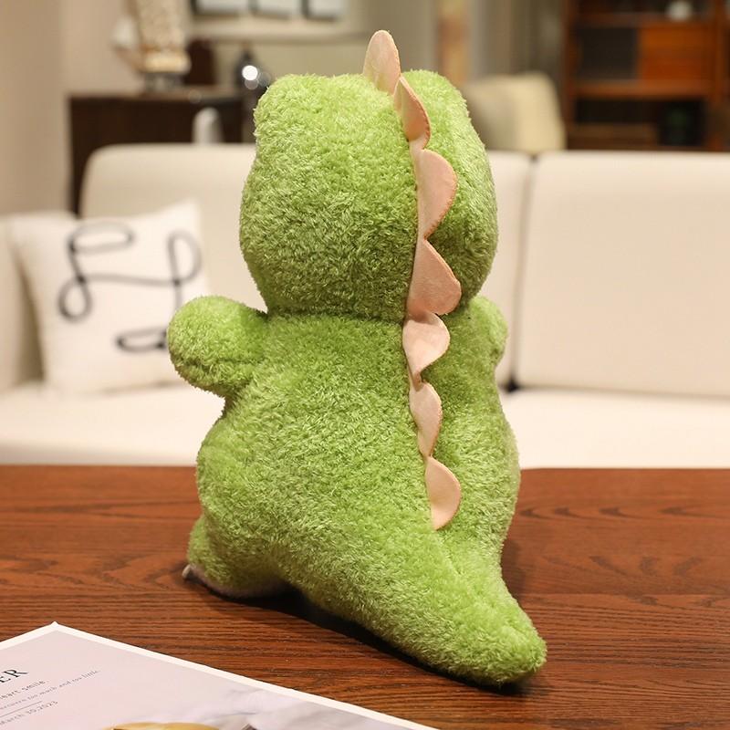Cute green dinosaur plush toy with adorable, big eyes and endearing expressions, perfect for kids. Soft and comfortable, it can be used as a sofa cushion. A fun gift for children’s festivals, birthdays, or Christmas.