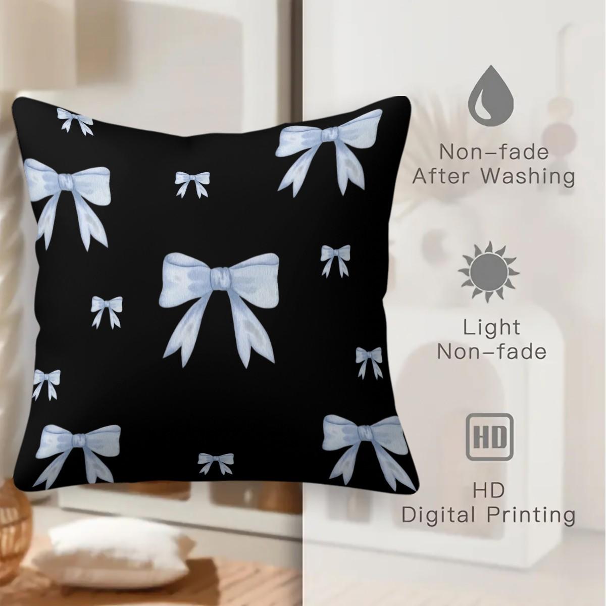 Soft short plush throw pillow with black background and blue bowknot print pattern, featuring a variety of patterns, soft and skin-friendly, a comfortable good for home or travel, embodying a lazy home style