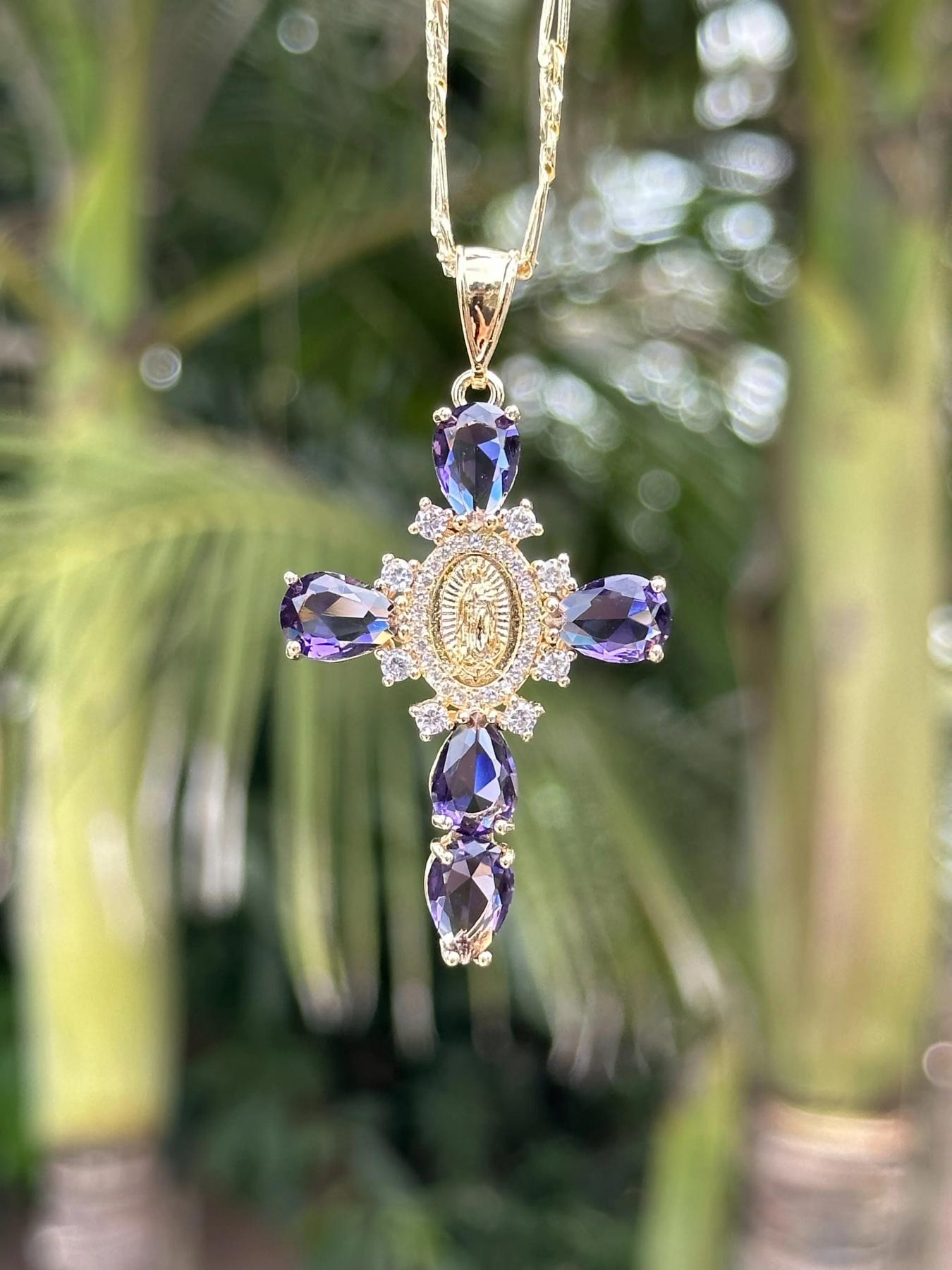 Our Lady of Guadalupe Cross Pendant NecklaceTeardrop Crystal Religious Jewelry. A golden cross adorned with a delicate image of the Virgin Mary, surrounded by sparkling teardrop-shaped crystals, available in purple/pink/transparent colors