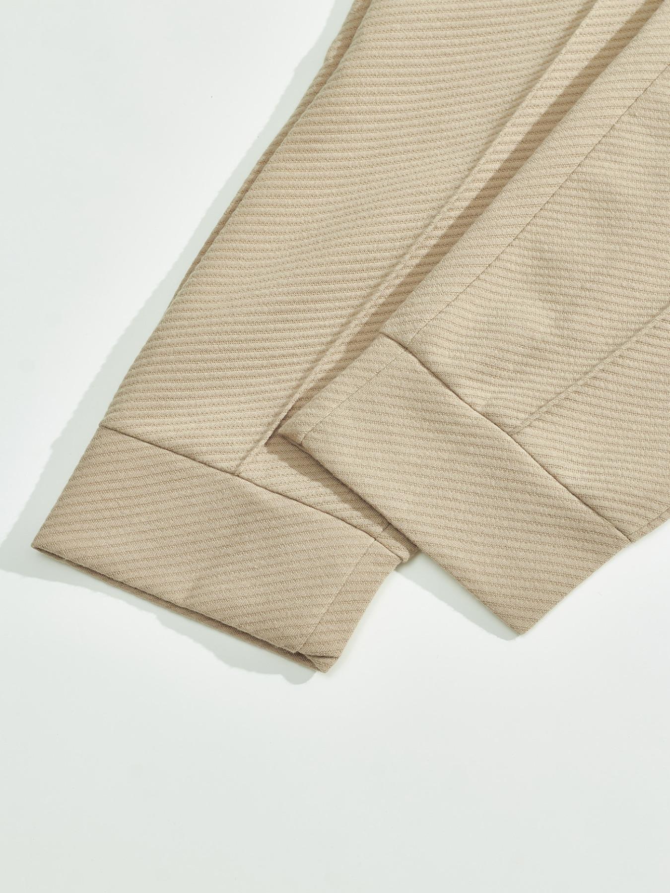 Men's two-piece casual suit outfit with a stand-up collar, long sleeves with a subtle texture, and long pants. The top has a single- button front with a pocket, suitable for daily outings, casual commuting, and light business casual occasions. Men's suit.