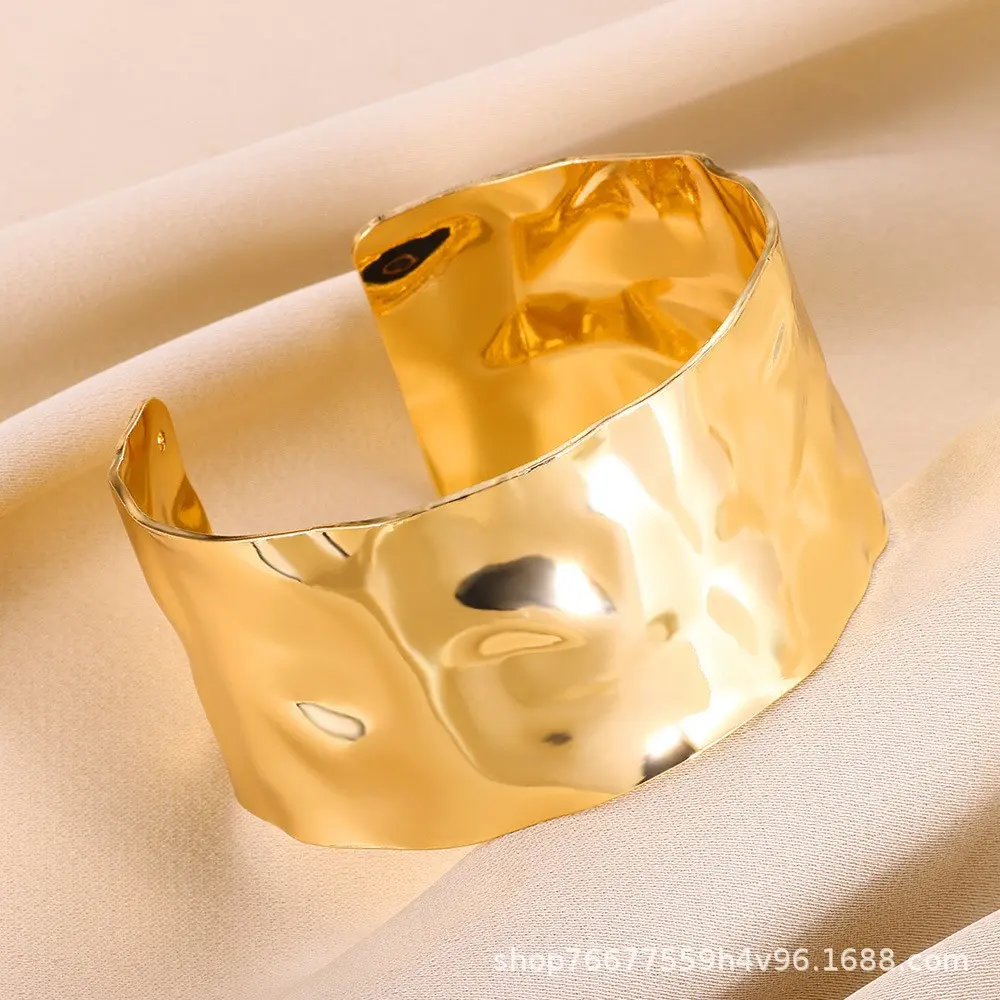 Golden pleated wide opening bracelet