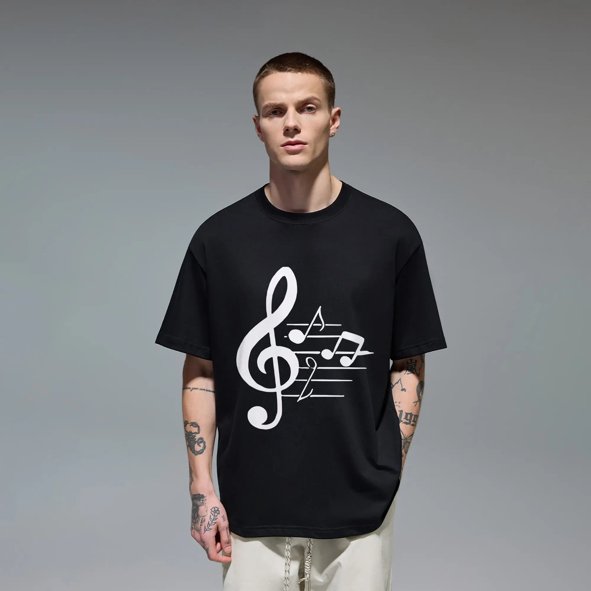 Music‑lover Men's T‑Shirt sewn with Quality Cotton, features clean minimalist white treble clef and musical notes graphic print. Smooth breathable crew‑neck loose cut, understated casual top for musicians, band fans and everyday street‑wear looks.