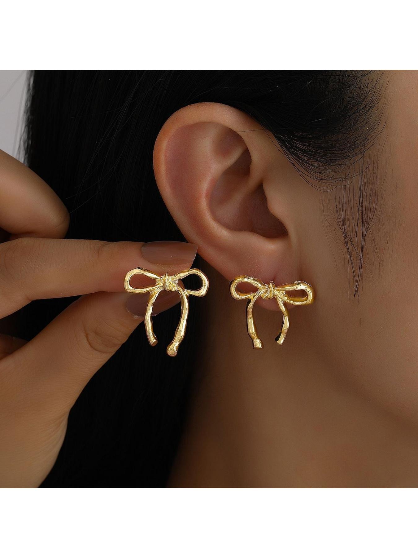 Hollowed-out bow earrings, women's stud earrings, simple and unique earrings, minimalist retro butterfly earrings.
