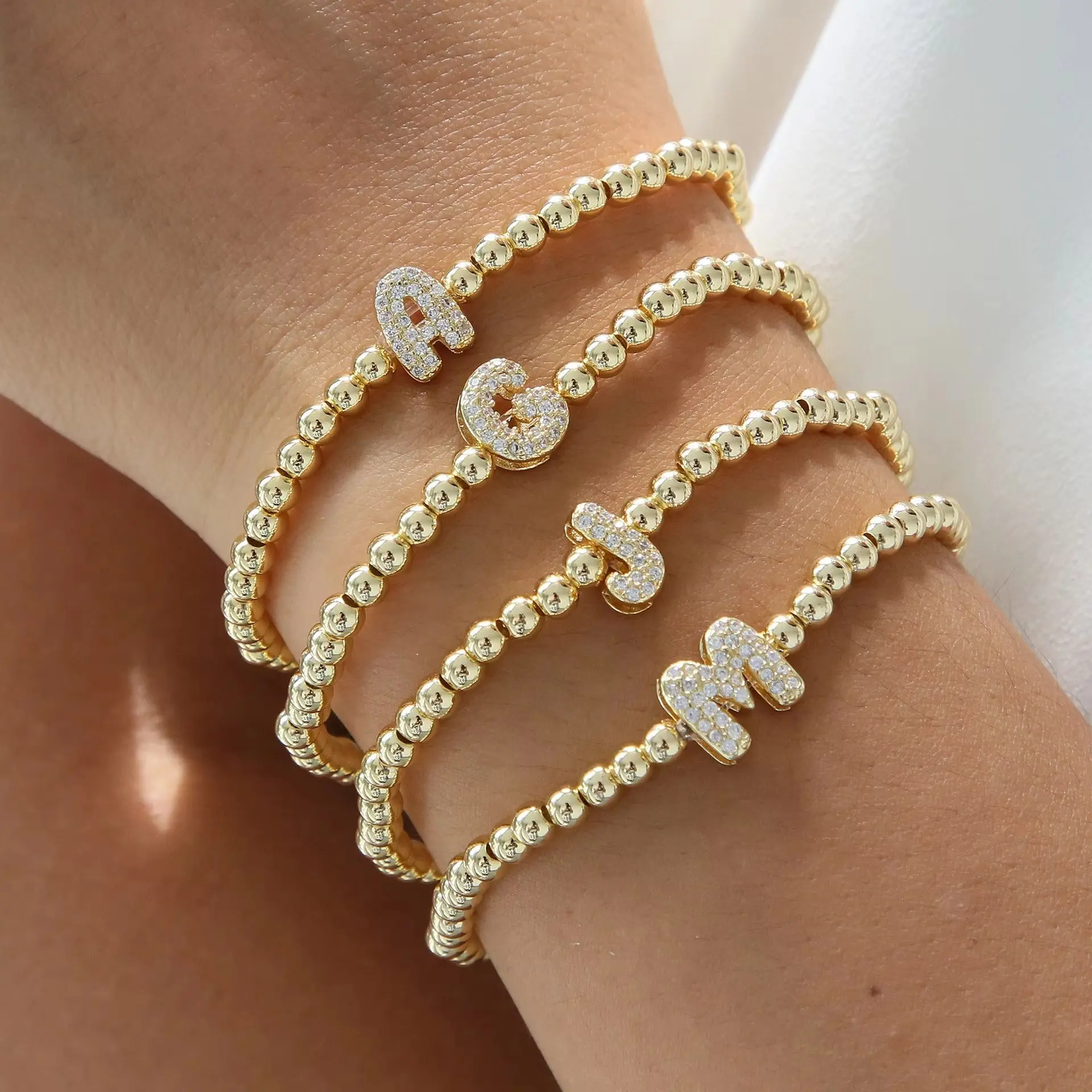 Women’s Letter Bracelet Dainty Beaded Initial Bracelet with Copper Beads Elastic Cord Elegant Sparkling Letter Bracelet Trendy All Season Jewelry for Daily Wear Birthday Anniversary and Holiday Gifts